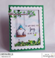 a handmade card with an image of a cat on a swing and the words do what brings you joy