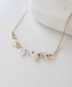 Genevieve Gemstone Arc Necklace Delicate Adjustable Faceted Necklace, Gold Moonstone Gemstone Beads Necklace, Gold Moonstone Necklace With Gemstone Beads, Delicate 14k Gold Filled Briolette Necklace, Delicate Everyday Crystal Necklace With Delicate Chain, Delicate Crystal Necklace With Adjustable Chain, Gold Moonstone Briolette Necklace, Gold Moonstone Necklace With Briolette Shape, Gold Necklace With Moonstone Briolette