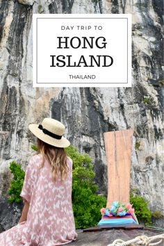 a woman in a hat sitting on a rock with the words, day trip to hong island