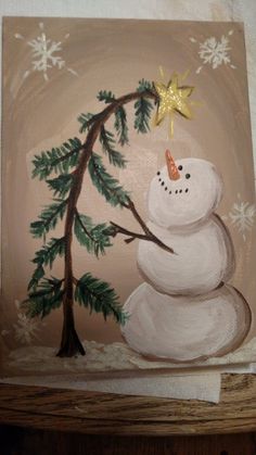 a painting of a snowman holding a star