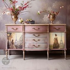 two vases with flowers on top of an old dresser in front of a wall