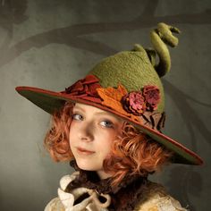 "A fancy witch hat encircled with Autumn leaves and flowers. The dimensions are approximately 15\" across and 10\" deep from brim to the top of the curly point. The point is reinforced with wire allowing you to position it however you like. The brim is bound in reddish brown Dupioni silk. You can order this hat in any color you like. There is no upcharge for a color change. How to measure your head: Use a soft measuring tape and measure around the middle of your forehead above the ears, and at t Green Witch Hat, Felt Witch Hat, Moldes Halloween, Nature Witch, Autumn Witch, Fairy Clothes, Dupioni Silk, Witch Costume, Fantasy Costumes