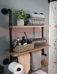 a bathroom with two shelves above the toilet