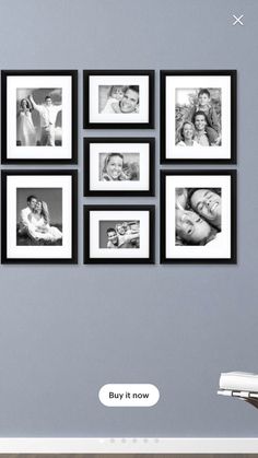 black and white photo frames hanging on the wall