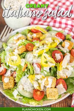 a white plate topped with salad next to a glass of milk