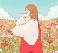 there is a woman holding a small dog in her arms and looking at the flowers