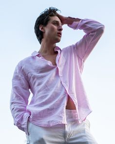 A staple for any vacation wardrobe this airy pale pink linen shirt looks great whether you're in your swim trunks, linen pants or jeans. All our solid color linen shirts have an extra surprise of our distinctive crossed palm M logo printed pink and white linen under the collar and inside the cuffs. Only to be seen if you want to show it! Pink Linen Shirt, M Logo, Linen Shirts, Linen Shirt Men, Pink House, Mens Linen, Pink Houses, Holiday Wardrobe, Pink Linen