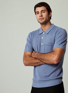 A pullover knitted sweater polo with complimentary contrast stitching at collar, pocket, sleeves, placket and bottom hem. Dress it up with a tailored jacked or keep it casual as you wear it solo. Details Models is 6'1" and wears a size medium. Care: Machine wash cold, on delicate cycle, do not tumble dry, do not iron, dry flat, do not dry clean Composition: 40% Viscose | 30% Re-Polyester | 30% Nylon | 7DIAMONDS Men's Enzo Sweater Polo Shirt in Med Blue | Size XL | Polyester/Nylon Fitted Blue Polo Sweater With Short Sleeves, Fitted Short Sleeve Blue Polo Sweater, Fitted Blue Short Sleeve Polo Sweater, Blue Fitted Short Sleeve Polo Sweater, Casual Winter Polo Shirt With Ribbed Cuffs, Blue Casual Polo Sweater With Polo Collar, Relaxed Fit Collared Polo Sweater For Business Casual, Blue Casual Polo Sweater, Blue Cotton Polo Sweater For Workwear