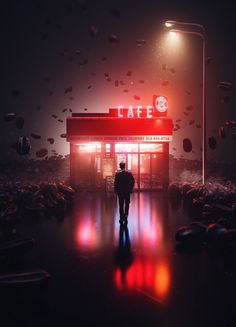 a man standing in front of a store at night with balloons flying around him and the lights on