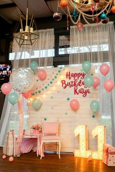 a birthday party with balloons and decorations