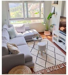 a living room filled with furniture and a flat screen tv