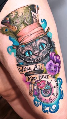 a woman's thigh with a cat wearing a top hat