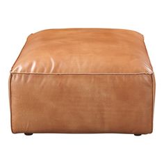 a large brown leather ottoman sitting on top of a white floor