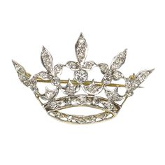 An antique diamond crown brooch, with Edwardian and old-cut diamonds, in grain and rub over settings, mounted in yellow gold with platinum settings, circa 1915, with a pin and roller catch fitting. Estimated total diamond weight 1.20 carats. Antique Crown, Diamond Crown Ring, Crown Brooch, Edwardian Jewelry, Diamond Bows, Diamond Crown, Antique Brooches, Diamond Brooch, Heart Pendant Diamond