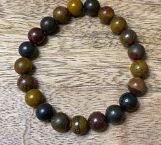 10mm Chinese writing stone beads. Handmade stretch bracelet. Brown Spiritual Faceted Beads, Spiritual Brown Faceted Beads, Brown Faceted Spiritual Beads, Chinese Writing, Beads Handmade, Stone Bracelet, Stretch Bracelet, Stretch Bracelets, Stone Beads