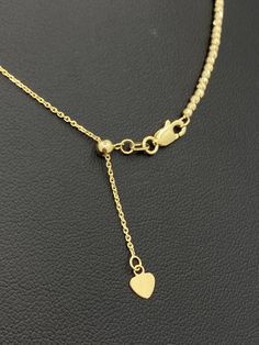 "Get that perfectly sized choker in Solid 14K Gold with this perfect Italian Moon Cut Necklace. Genuine 14K Gold Moon Cut Ball Bead Chain 2mm This sparkling piece is a must add item to your jewelry collection. Diamond cut for that extra added sparkle. Our Lightweight Necklace is Comfortable & Enjoyable to Wear Alone! Makes the perfect choker necklace and layers perfectly. Comes in a Premium Gift Box! Please note that this is a delicate link that requires extra care against breakage due to it Adjustable Yellow Gold Necklace With Round Beads, Adjustable Rose Gold Necklace With Round Beads, Adjustable Rose Gold Beaded Necklace, Elegant Ball Chain Choker, Rose Gold Single Strand Necklace With Round Beads, Rose Gold Plated Necklaces With Satellite Chain, Gold Choker With Adjustable Chain And Round Beads, Gold Choker With Round Beads And Adjustable Chain, Yellow Gold Necklace With Clavicle Chain And Round Beads