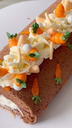 a piece of cake with icing and carrots on it