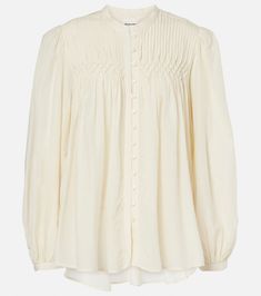 Dorothe cotton-blend voile blouse in white - Marant Etoile | Mytheresa Chic Cotton Top With Pintucks, Chic Cotton Tops With Pintucks, Pintuck Tops For Daywear In Fall, Fall Daywear Tops With Pintucks, Cotton Blouse With Button Closure For Daywear, Fall Tops With Pintucks For Daywear, Elegant Rayon Blouse For Fall, Classic Viscose Tops With Button Closure, Fall Viscose Button-up Shirt