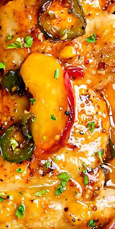 a close up of chicken and vegetables in gravy