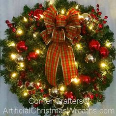 a christmas wreath decorated with lights and ornaments