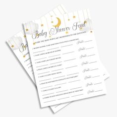 two baby shower game cards with gold stars and moon on the top, in white paper