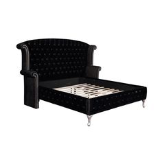 a black velvet bed with metal legs and headboard, made to look like an armchair