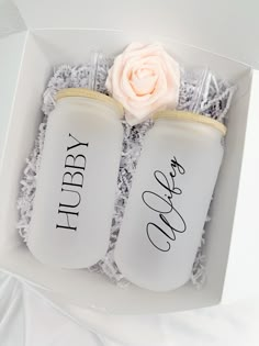 two personalized mason jars in a gift box with a rose on the top one is for hubby and the other is for her