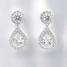 Enhance your elegance with our 925 Sterling Silver Simulated Diamond Cubic Zirconia Earrings for Women. These stunning earrings are meticulously crafted from high-quality 925 sterling silver, ensuring longevity and a timeless shine. Each earring features a brilliant cubic zirconia simulated diamond, expertly cut to radiate a dazzling sparkle. Designed to complement any outfit, from casual to formal, these earrings are the perfect accessory for every occasion. The secure and comfortable fit allows you to wear them all day or night with ease. Whether you're treating yourself or looking for a thoughtful gift, these earrings are sure to captivate and impress. Features: - Crafted from premium 925 sterling silver for lasting durability and shine. - Adorned with cubic zirconia simulated diamonds Luxury Silver Teardrop Earrings As Gift, Luxury Silver Teardrop Earrings For Gift, Silver Cubic Zirconia Teardrop Earrings, Classic White Gold Crystal Earrings With Cubic Zirconia, Classic Cubic Zirconia Earrings With Elegant Design, Luxury Cubic Zirconia Teardrop Earrings Gift, Classic Teardrop Earrings In Brilliant Cut Cubic Zirconia, Classic Teardrop Earrings With Brilliant Cut Cubic Zirconia, Formal Cubic Zirconia Crystal Earrings With Halo Design