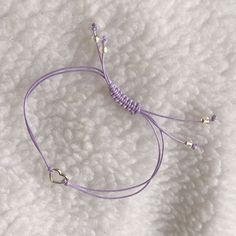 Purple string bracelet with silver heart charm.    Wear as a reminder of BTS coming back to us in 2025. Made of Korean waxed thread.   Finished with clear somewhat iridescent glass beaded  ends.  Lead nickel and cadmium free zinc alloy metal heart charm.  This bracelet fits wrists up to 9 inches around.  The length is adjustable with a sliding knot.  Pull both beaded ends to shorten length, and to lengthen pull knot away from wrist. AFBF!  Borahae! Purple Line, Infinity Charm, Thread Bracelets, Beautiful Notes, Simple Bracelets, Bracelet Diy, Metal Heart, Bracelet Online, Purple Heart