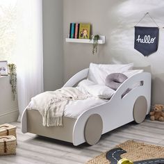 a child's bedroom with a toy car bed