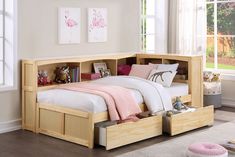 a child's bed with storage drawers underneath it