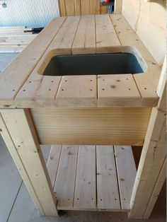 a wooden bench with a sink built into it