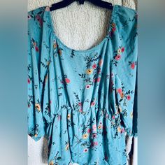 This Babydoll Style Blouse Can Be Worn Either On Or Off The Shoulders, Has Poofy Style Sleeves With Elastic Ends And Look Alike 3 Button Up Front. Nwot And Come From A Smoke Free Home. Color May Vary In Pictures Due To Lighting And Electronic Device. Color Is Blue Flowered Size Is Xl Printed Blue Tops For Daywear, Printed Blue Tops, Blue Printed Tops For Daywear, Short Sleeve Blouse With Floral Print For Loungewear, Blue Spring Loungewear Blouse, Cute Printed Blue Tops, Cute Blue Blouse With Floral Print, Blue Floral Print Tops For Loungewear, Blue Short Sleeve Blouse For Loungewear