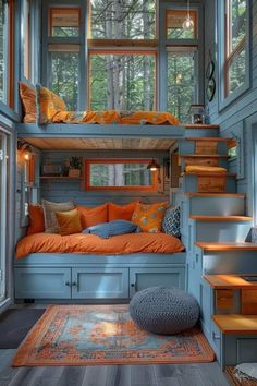 an orange and blue bedroom with stairs leading up to the loft bed in the room