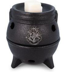 a black candle holder with a wax stick in it