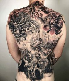 a man with many tattoos on his back