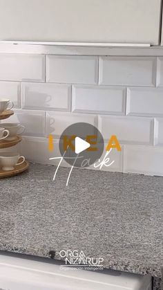 a stack of cups sitting on top of a kitchen counter