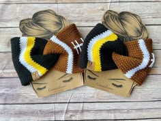 two crocheted hair bows with footballs on them