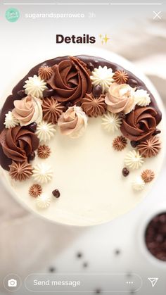 a white cake with chocolate frosting and flowers on top