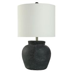 a black table lamp with a white shade