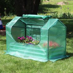 Raised garden beds are perfect to raise any type of plants as they allow better soil and moisture drainage and product a higher yield. Greenhouses or garden bed covers are perfect to protect your plants from freezing weather, frost, excessive heat, and too much moisture. This covered planter kit includes both a miniature greenhouse made with PE panels and an iron tube frame and a galvanized steel planter box. The cover frame and panel materials make this greenhouse equipped to easily withstand h Garden Bed Cover, Miniature Greenhouse, Mini Serre, Greenhouse Cover, Portable Garden, Planter Beds, Freezing Weather, Side Doors, Small Greenhouse