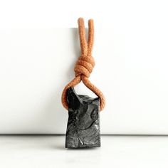 Elevate your energy with our Elite Shungite Pendant. Each piece is one-of-a-kind, handcrafted to showcase the purifying energy and protective properties of Elite Shungite. Experience vitality and protection in an elegant design. Spiritual Black Necklace With Raw Stone, Black Hematite Jewelry As A Gift, Black Hematite Jewelry Gift, Black Hematite Jewelry For Gift, Black Lava Stone Necklace For Gift, Elite Shungite, Chakra Activation, Gemstone Pendant Necklace, Pure Energy