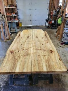 a table made out of wood in a garage