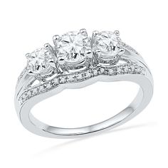 three stone diamond ring in white gold with diamonds around the band and sidestones on each side