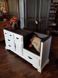 an old dresser has been converted into a storage bench