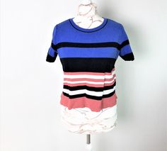 "Vtg striped women sweater with short sleeves. Top, knitted shirt. On the sides are decorative splits. Large Size L. Made in Turkey. colors: cobalt blue, berry red, white, black. material: cotton 51%, 49% viscose - on the label. Wash in 30 C. condition: great, a little used condition. Labeled size = 12 UK. Estimated size: L. measurements: length 50cm / 19.5\" in shoulders width 39 cm / 15.2'' in armpit to armpit 52 cm / 20,3\" in sleeves length from shoulder seam 21,5 cm / 8.4\" in" Spring Knit Tops With Horizontal Stripes, Fitted Striped Crew Neck Knit Top, Fitted Striped Knit Top With Crew Neck, Striped Stretch Knit Top With Crew Neck, Blue Knit T-shirt For Spring, Blue Knit T-shirt For Summer, Trendy Striped Crew Neck Knit Top, Fitted Striped Knit Top, Striped Knit Tops With Short Sleeves