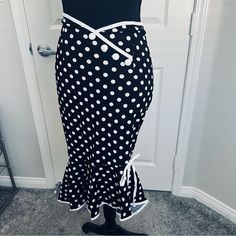 Super Cute Vintage Style Skirt With Classic Fishtail Silhouette. Black With White Polka Dots And It Features White Buttons At Side Waist. Can Be Worn As A Skirt Or Pull It Up As A Short Dress. Size Small (4) 100% Polyester- Machine Washable **Brand New But No Tags. Poshmark Doesn’t Offer An Option To Choose New With No Tags. *Comes From A Smoke Free Home Chic Fitted Polka Dot Skirt, Fitted Polka Dot Knee-length Skirt, Fitted Knee-length Polka Dot Skirt, Fitted Polka Dot Skirt With Lining, Retro Fitted Skirt With Button Closure, Vintage Style Skirts, Fishtail Skirt, Style Skirt, Black Polka Dot