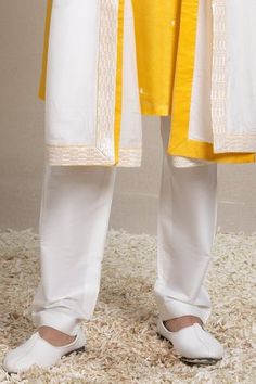 Shop for Sanjev Marwaaha Yellow Modal Sequin Embellished Placket Kurta Pant Set for Men Online at Aza Fashions Festive Pants With Embroidered Border For Festivals, Eid Cotton Bottoms With Embroidered Border, Cotton Pants For Festive Occasion And Eid, Festive Cotton Pants For Eid, Festive Cotton Pants With Embroidered Border, Festive Cotton Bottoms With Embroidered Border, Cotton Straight Kurta Bottoms For Festive Season, Festive Cotton Straight Kurta Bottoms, Traditional Cotton Pants With Embroidered Border