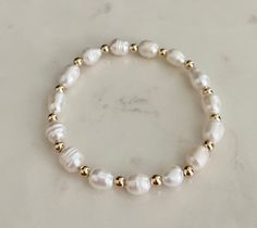 Gold Pearl Bracelet With Beads For Everyday, Summer Gold Beaded Pearl Bracelet, Dainty Hand-strung Pearl Bracelets, Gold Beaded 14k Gold-filled Pearl Bracelet, Elegant Handmade 14k Gold-filled Pearl Bracelet, Stretchy Beaded Bracelet, Bracelet Keychains, Freshwater Pearl Bracelet, Bracelet Design