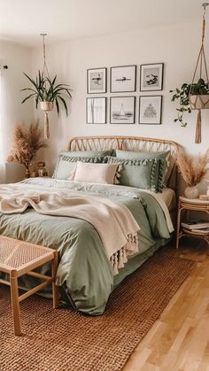 a large bed sitting in a bedroom on top of a wooden floor next to a window